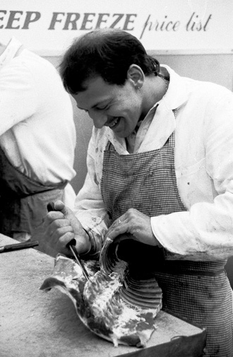 Butcher at a market stall