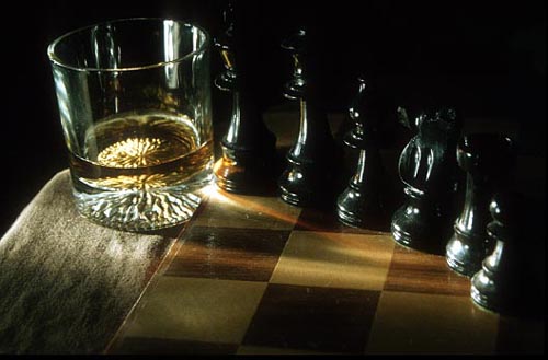 whisky glass with chess pieces