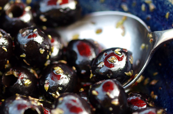 Garlic olives under an Orange Umbrella.