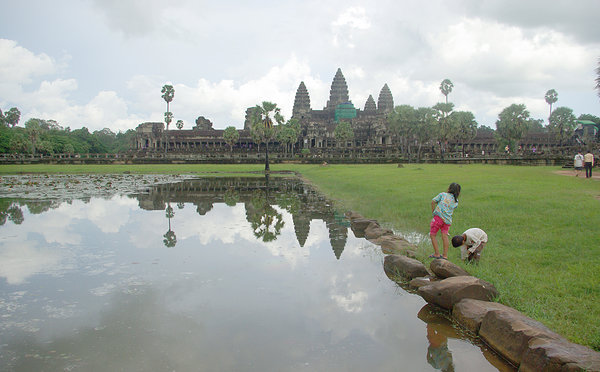 Children playing in front of Angkor Wat temple, Cambodia