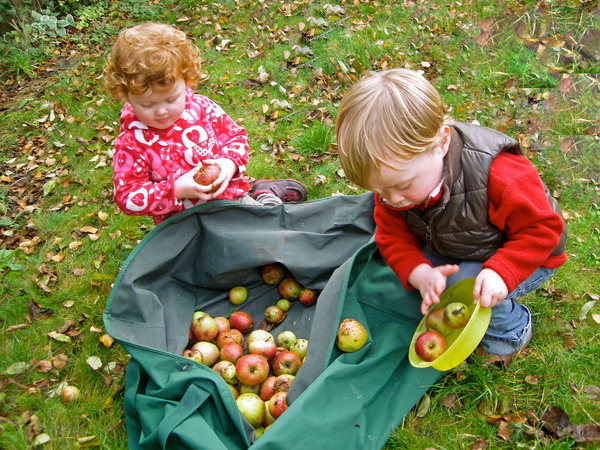 Emma and Joe tidying the garden