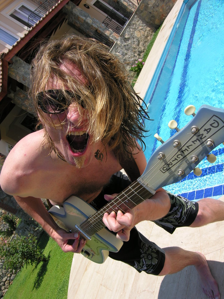 Me with guitar & pool