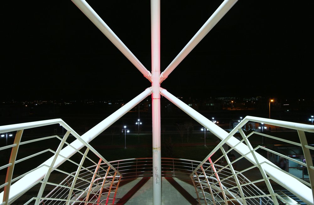 Neon Lit Symmetry of Railings