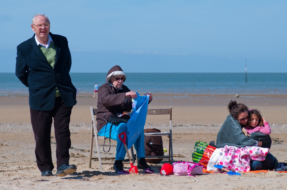British Family on cold springtime beach