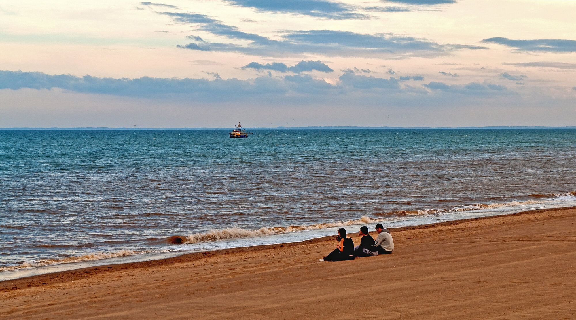 The beach the boat and the sea