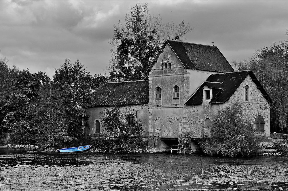 Mill with blue boat