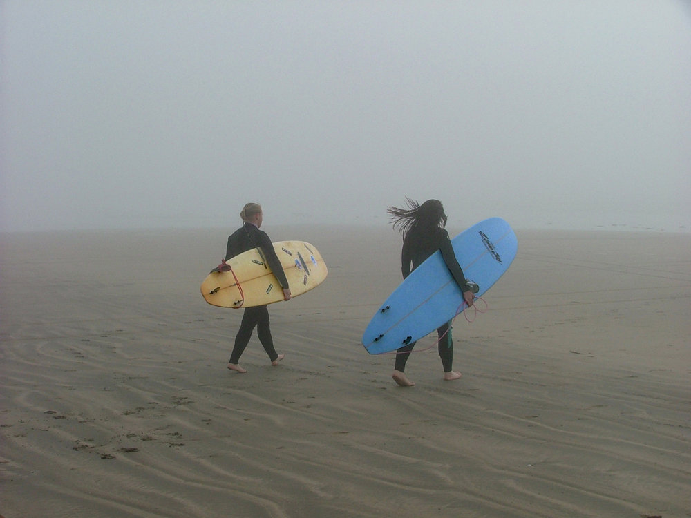 Surfers in the mist