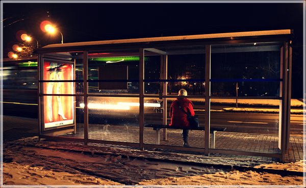 One legged women waits for night bus!