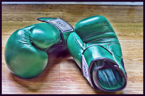 Green sparring gloves.
