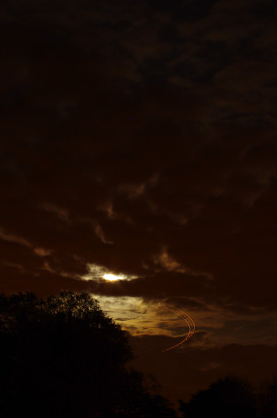 Super moon plus aeroplane trails
