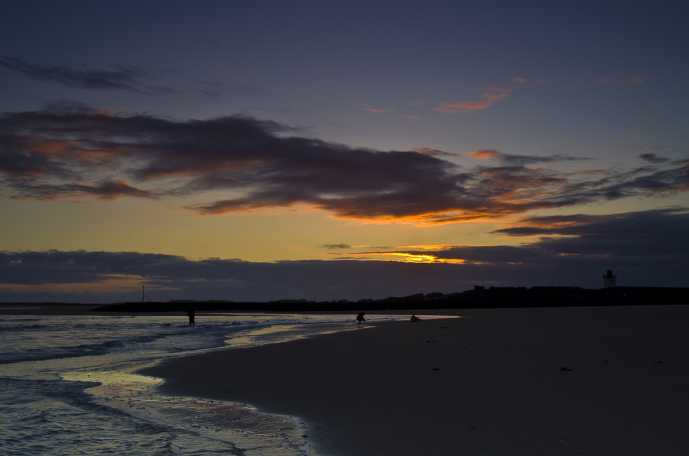 Burry Port Beach and lighthouse at sunset