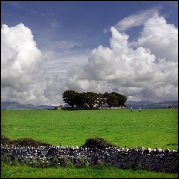 Knoll with Distant Clouds