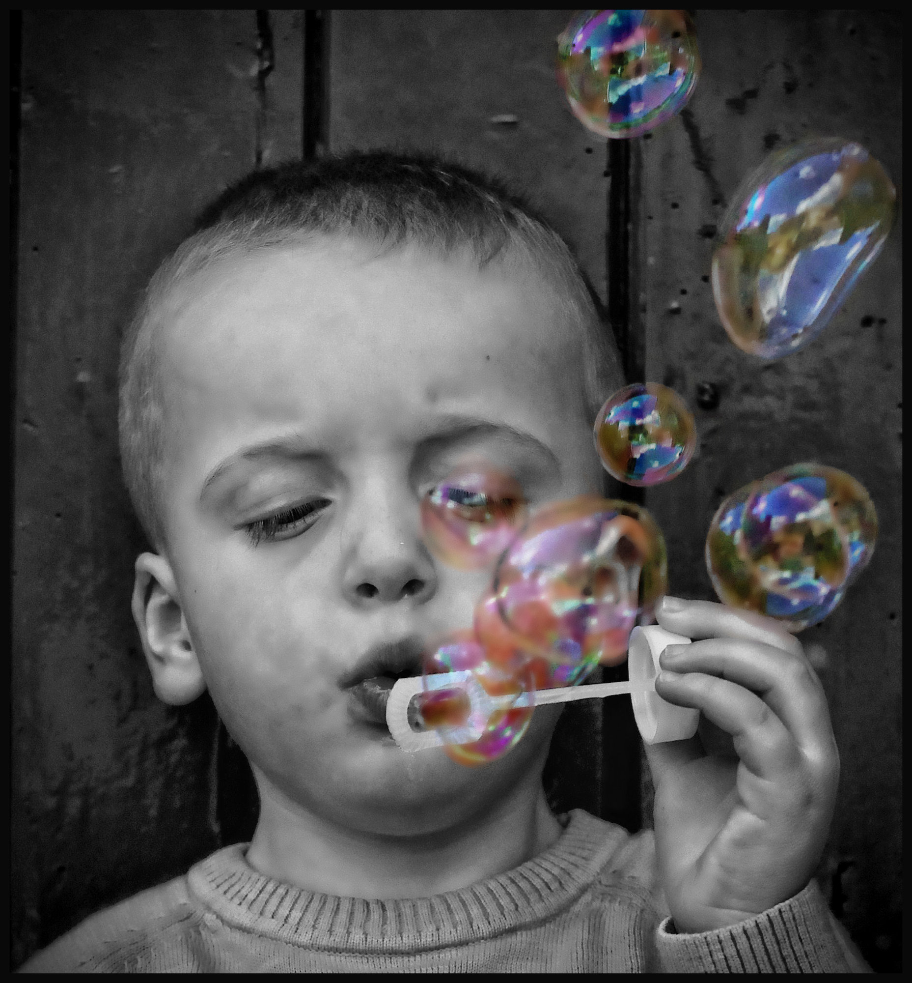 Blowing bubbles.