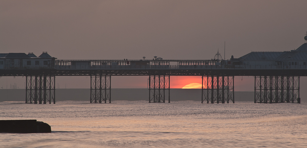 sunrise thru' the pier