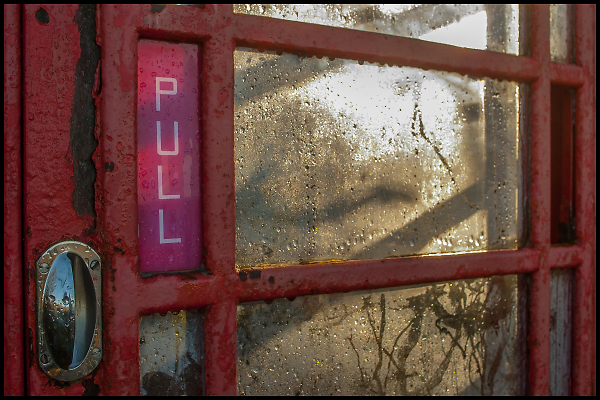 K6 Telephone Box with Condensation and early Sunshine