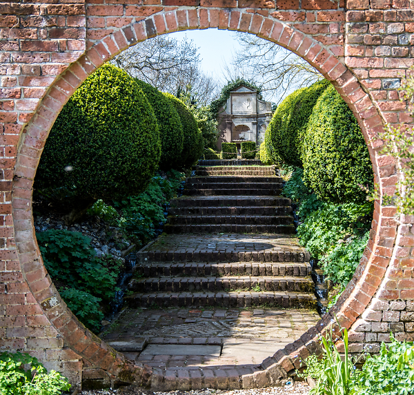 Through the garden wall