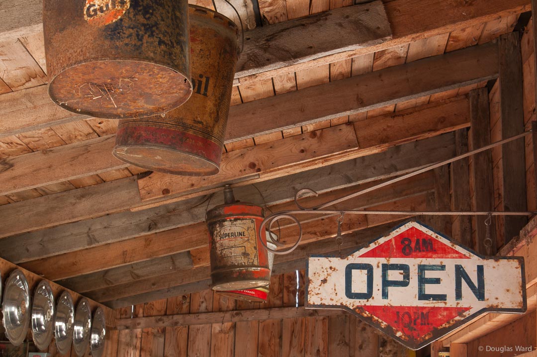 oil cans hanging from the rafters