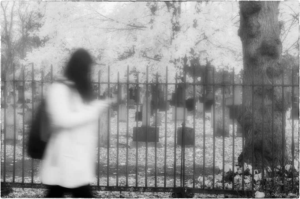 ghost in front of grave yard