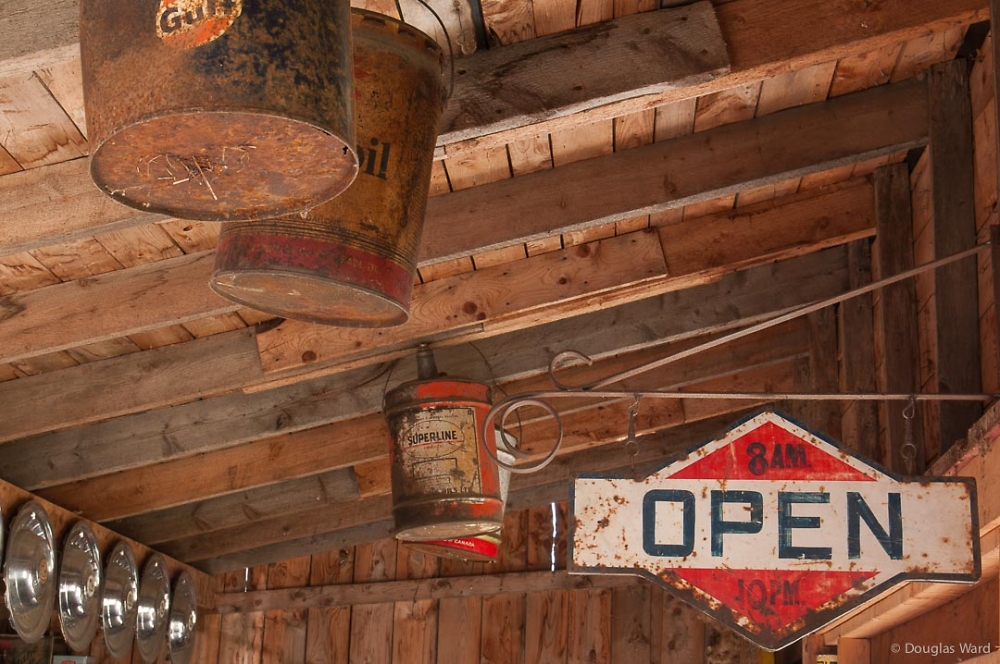 oil cans hanging from the rafters