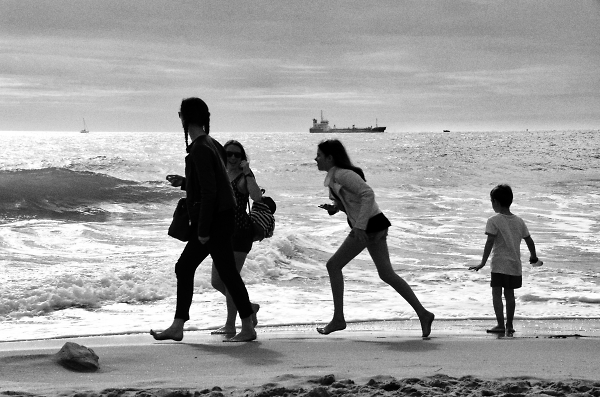 Kids on a beach  time to go home