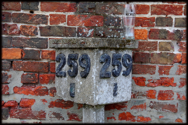Railway milepost with glass