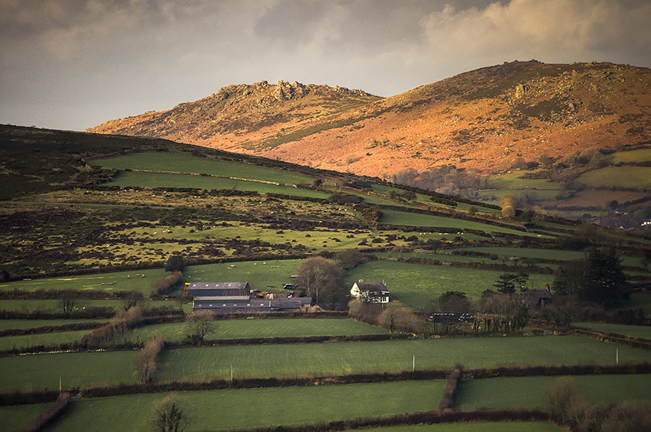 Stormlight falling on Honeybag Tor and Chinkwell Tor