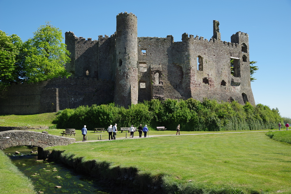 Walkers passing Laugharne Castle