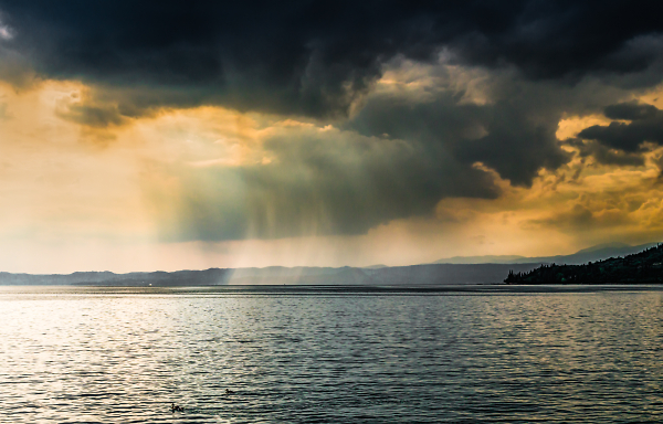 Storm on Lake Garda, Italy. and two passing ducks.