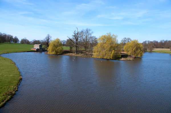 A Lake a Boathouse and an Island