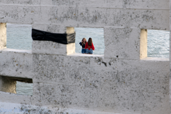 Through the wall.