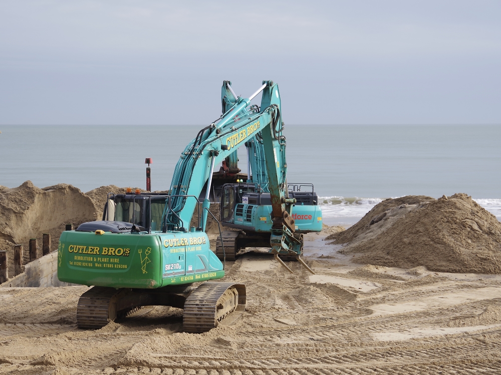 Replacing grounds on Bournemouth beach.