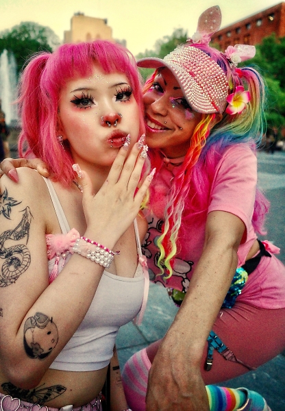 Colorful pair pose for a photo