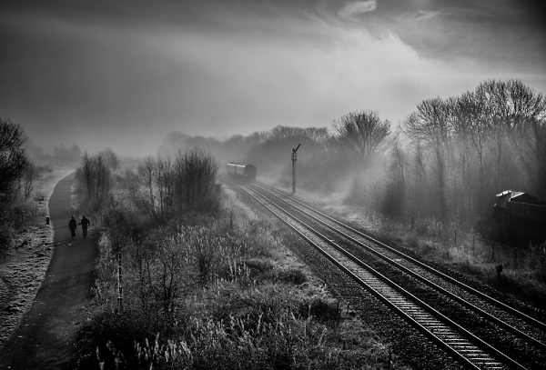 Fog, mist,train and Two out walking.