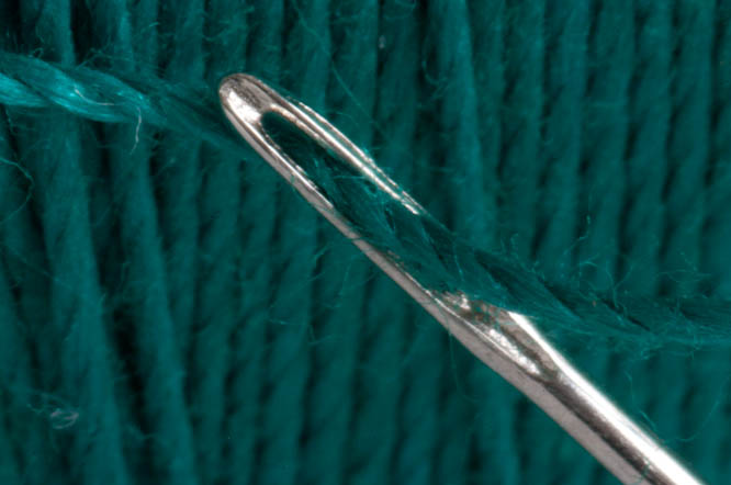 Close up of a needle and thread Close up of a needle and thread